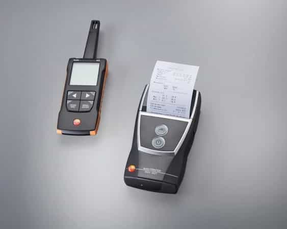 Termohigrometr testo 625 obok drukarki termicznej drukującej protokół z pomiarów (miniatura)